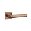 Tev Handles' Salice handle in PVD copper adds a premium touch to modern spaces with its elegant slim square rosette design.