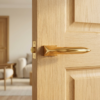 Luxurious PVD Gold Gladiola on Hidden Rosette hidden rosette internal door handles with a high-shine reflective finish on a natural oak wood door.