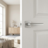 Strong square internal door handles in a sleek satin chrome finish from the Pea on Square Rosette range, installed on a bright white interior door.