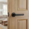 Elegant internal door handles with the Alora lever on a round rosette in a matt black finish, adding a modern contrast to a light interior door.