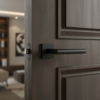 Minimalist internal door handles in matt black, featuring the Arabis lever on a square rosette with a sleek contemporary design
