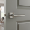 Minimalist internal door handles in polished chrome, showcasing the Arabis lever on a square rosette with a refined modern finish