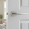 Minimalist internal door handles in satin chrome, featuring the Arabis lever on a square rosette with a subtle brushed finish