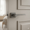 Bergenia on Square Rosette in graphite, an understated choice for elegant door handles for internal doors on a neutral panelled door.