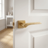 Bergenia on Square Rosette in matt gold, an elevated option for elegant door handles for internal doors on a white interior door.