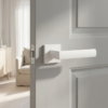 Designer square door handles – Hosta on Square Rosette in matt white on a light grey internal door, featuring a sleek lever design with a modern square rose.
