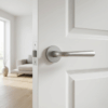 Satin chrome Irga on Round Rosette, premium round internal door handle fitted to a white interior door.
