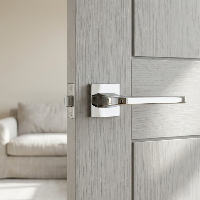 Ismena - Polished Chrome Ismena luxury square internal door handles in polished chrome, highlighting clean square lines and a reflective finish on a modern internal door.