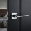 Brilliant polished chrome Lila on Square Rosette minimalist square internal door handles with a reflective mirror-like finish.