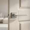 Lila on Square Rosette minimalist square internal door handles in smooth satin chrome on a modern light oak internal door.