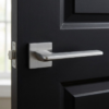 Lunaria on Square Rosette premium square internal handles in a sleek satin chrome finish, mounted on a modern dark charcoal grey door.