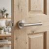 Papavera on Round Rosette in satin nickel, classic round door handles installed on a natural oak internal door.