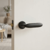 Peonia on Round Rosette in matt black, premium round internal handles for modern interior doors.